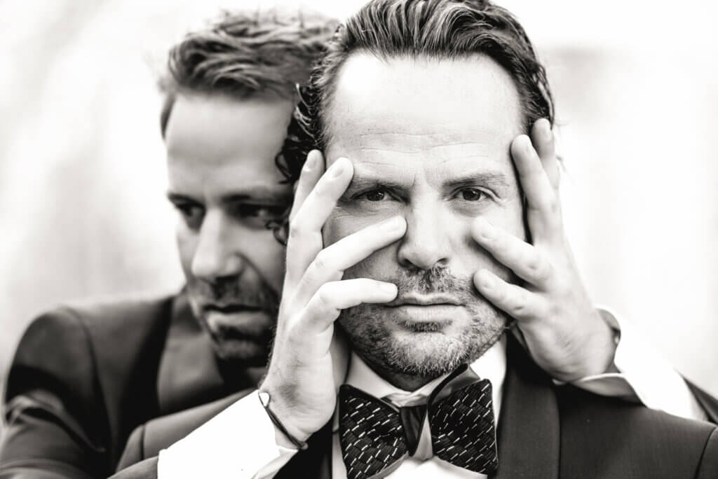 NYC Engagement and Wedding Photographer capturing a same-sex couple in the cobblestone streets of the West Village.